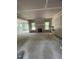 Unfinished living room with exposed walls, fireplace, and windows overlooking the backyard at 70 Valebrook Ct, Youngsville, NC 27596
