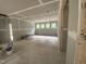A spacious living room with drywall, multiple windows for ample natural light and a ladder at 70 Valebrook Ct, Youngsville, NC 27596