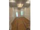 Well-lit office space with wainscoting and a unique ceiling design, perfect for a home office at 70 Valebrook Ct, Youngsville, NC 27596