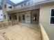 Back patio featuring a wooden deck and an exterior in progress at 70 Valebrook Ct, Youngsville, NC 27596