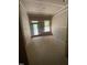 Small unfinished room with view to the outdoors through sliding door, drywall installed but not painted at 70 Valebrook Ct, Youngsville, NC 27596