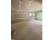 Unfinished room with drywall installed, visible pipes, and windows providing natural light at 70 Valebrook Ct, Youngsville, NC 27596