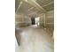 Unfinished room with open doorway leading to other areas, and stairs visible in the background at 70 Valebrook Ct, Youngsville, NC 27596