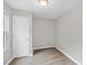 Cozy bedroom with neutral gray walls, wood floors and a large window at 708 Brye St, Durham, NC 27703