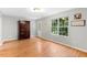Bright living room boasting hardwood floors and natural light from a large window at 708 Brye St, Durham, NC 27703