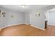 Open living room featuring hardwood floors and neutral gray walls at 708 Brye St, Durham, NC 27703