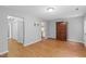 Spacious living room featuring wood floors and neutral gray walls at 708 Brye St, Durham, NC 27703