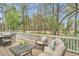 Spacious back deck featuring comfortable seating and scenic wooded views at 76501 Rice, Chapel Hill, NC 27517