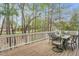 Wooden deck with outdoor seating, overlooking a wooded area for privacy at 76501 Rice, Chapel Hill, NC 27517