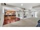 Open basement with wet bar, dining area, and lounge space is perfect for entertaining or relaxation at 76501 Rice, Chapel Hill, NC 27517