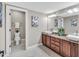 Bathroom boasts double sinks, stone countertops, and a separate toilet room for added privacy at 76501 Rice, Chapel Hill, NC 27517