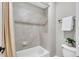 Cozy bathroom featuring a shower-tub combination with neutral tile at 76501 Rice, Chapel Hill, NC 27517
