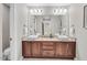 Bathroom featuring granite countertops, dual sinks, and modern lighting fixtures at 76501 Rice, Chapel Hill, NC 27517