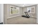 Well-lit exercise room featuring natural light and neutral paint at 76501 Rice, Chapel Hill, NC 27517