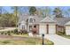 Charming home with well-manicured lawn, two-car garage, and mature trees at 76501 Rice, Chapel Hill, NC 27517