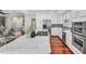 Spacious kitchen with stainless steel appliances, marble countertops, and an open view of the living area at 76501 Rice, Chapel Hill, NC 27517