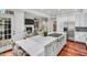 Kitchen with stainless steel appliances, marble countertop island, and an open concept living space at 76501 Rice, Chapel Hill, NC 27517