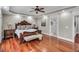 Spacious main bedroom with a tray ceiling, hardwood floors and elegant furnishings at 76501 Rice, Chapel Hill, NC 27517