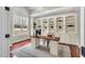 Bright office with custom built-ins, a modern desk, and a large window at 76501 Rice, Chapel Hill, NC 27517