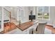 Stylish office featuring a modern desk, custom cabinetry, and a hardwood floor at 76501 Rice, Chapel Hill, NC 27517
