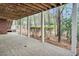 Spacious covered patio featuring a wood ceiling, white columns, and views of the backyard at 76501 Rice, Chapel Hill, NC 27517
