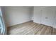 A modern and spacious bedroom featuring wood-style floors and white walls at 795 Terry Rd, Hurdle Mills, NC 27541
