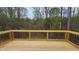 A spacious deck overlooks a natural landscape, perfect for outdoor relaxation at 795 Terry Rd, Hurdle Mills, NC 27541