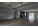 Spacious living room flows into the kitchen and features wood flooring and recessed lighting at 795 Terry Rd, Hurdle Mills, NC 27541