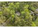 Secluded home nestled among lush trees with a deck and backyard, offering privacy at 8008 Hollander Pl, Raleigh, NC 27606