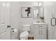 Neat bathroom with a toilet, storage vanity, and modern lighting, great for a contemporary home at 8008 Hollander Pl, Raleigh, NC 27606