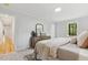 Calm bedroom featuring neutral tones, a serene window view, and plush carpet for a relaxing retreat at 8008 Hollander Pl, Raleigh, NC 27606