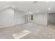 A well-lit bonus room with carpet, recessed lighting, closet, and a view from the large window at 8008 Hollander Pl, Raleigh, NC 27606