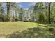 Beautiful home showcasing the deck, gazebo, and spacious backyard with mature trees at 8008 Hollander Pl, Raleigh, NC 27606