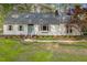 Charming single-story home featuring a brick foundation and a well-manicured front lawn at 8008 Hollander Pl, Raleigh, NC 27606