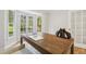 Lovely office with hardwood floors, a large desk with view, and French doors leading to the outside at 8008 Hollander Pl, Raleigh, NC 27606