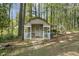 Charming outbuilding with a covered porch, perfect for a studio or guest house at 8008 Hollander Pl, Raleigh, NC 27606