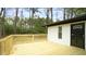 Large outdoor deck with railing system and backyard access at 909 Windcrest Rd, Durham, NC 27713