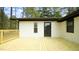 New wooden deck features access to home and expansive outdoor space at 909 Windcrest Rd, Durham, NC 27713