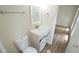 Updated bathroom with modern vanity and new toilet at 909 Windcrest Rd, Durham, NC 27713