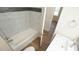 Bathroom view of tub with a gray accent tile at 909 Windcrest Rd, Durham, NC 27713