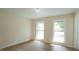 Bright bedroom with updated flooring and two large windows at 909 Windcrest Rd, Durham, NC 27713