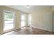 Bright bedroom with large windows and new flooring at 909 Windcrest Rd, Durham, NC 27713