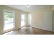 Bedroom with two windows allowing for natural light at 909 Windcrest Rd, Durham, NC 27713