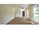 Welcoming entryway featuring wood-look floors, a modern door, and ample natural light at 909 Windcrest Rd, Durham, NC 27713