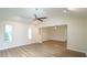 Open floorplan living room featuring new flooring and high ceilings at 909 Windcrest Rd, Durham, NC 27713