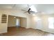 Open floorplan living room featuring new flooring and high ceilings at 909 Windcrest Rd, Durham, NC 27713