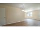 Spacious living room features new flooring and ample natural light at 909 Windcrest Rd, Durham, NC 27713