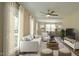 Bright living room with large windows, comfortable seating, and modern decor at 909 Windcrest Rd, Durham, NC 27713