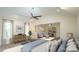 Large main bedroom with sitting area, fan, skylight and lots of windows at 909 Windcrest Rd, Durham, NC 27713