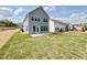 New construction home with a spacious backyard and concrete patio at 91 Brooklynn Trl # 187, Angier, NC 27501